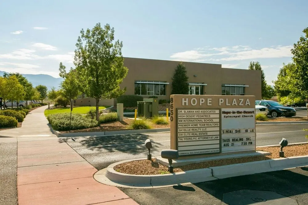 The Hope Plaza sign at 8650 Alameda Blvd NE, with Dr. Slaman and Associates listed first.
